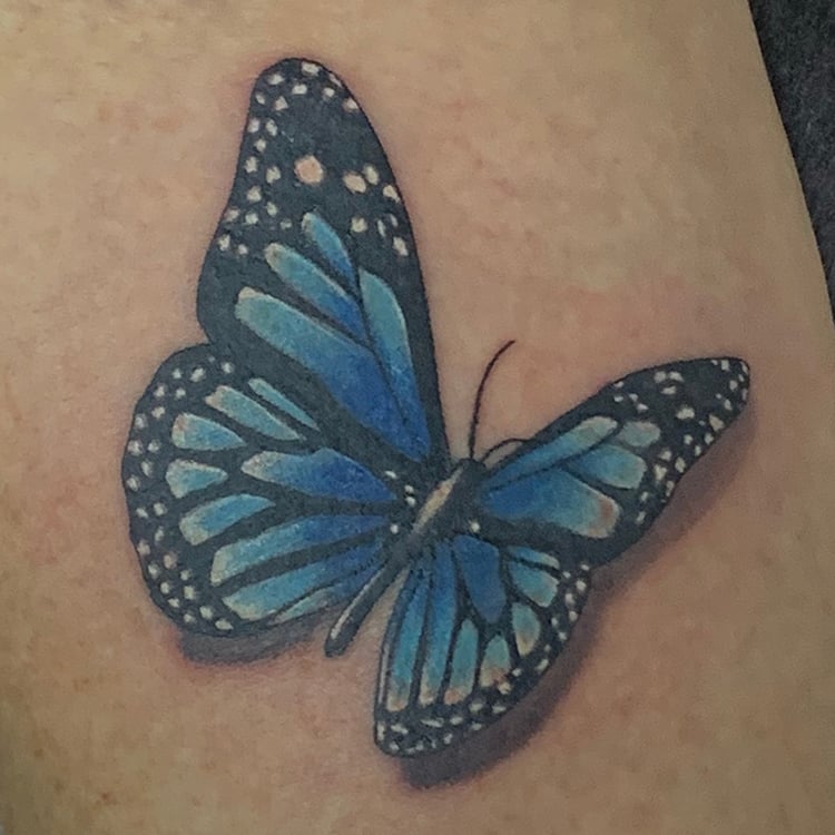 Kleine tattoo voorbeeld vlinder onderarm