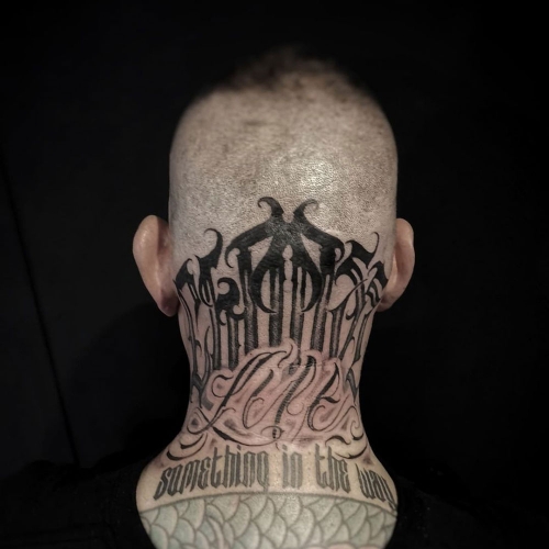 Freehand lettering in nek tattoo Lorenzo