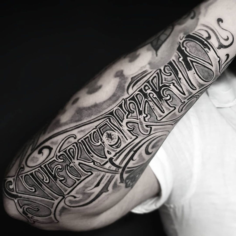 Freehand lettering onderarm sleeve tattoo Lorenzo