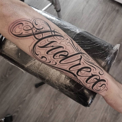 Freehand lettering sleeve tattoo Lorenzo
